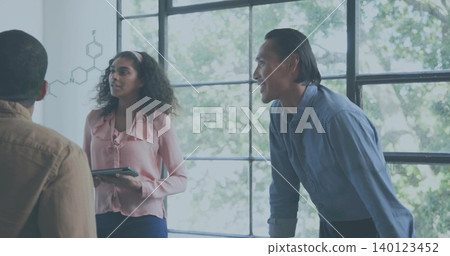 Presenting woman in pink blouse holding tablet and referring to chemical sketches on office window Presenting woman in pink blouse holding tablet and referring to chemical sketches on office window 140123452