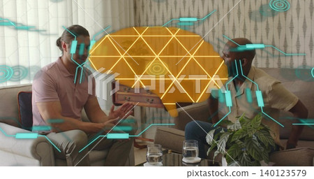 Talking, two men wearing pink polo and short-sleeve shirt gesturing in living room, brain hologram Talking, two men wearing pink polo and short-sleeve shirt gesturing in living room, brain hologram 140123579