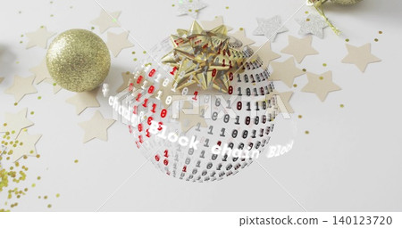 Showing orb wearing gold bow with binary digits on white tabletop, gold glitter balls and confetti Showing orb wearing gold bow with binary digits on white tabletop, gold glitter balls and confetti 140123720