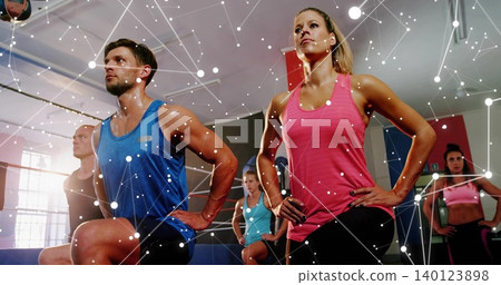 Lunging woman in pink tank keeping hands on hips in fitness studio, digital overlay Lunging woman in pink tank keeping hands on hips in fitness studio, digital overlay 140123898