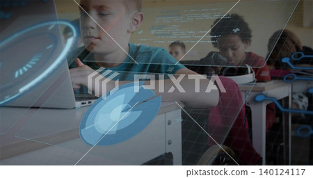 Typing boy in teal shirt working on laptop at school desk, showing AR overlays and wheelchair Typing boy in teal shirt working on laptop at school desk, showing AR overlays and wheelchair 140124117