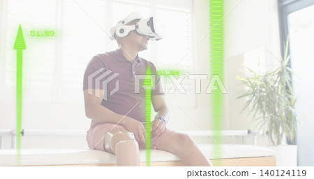 Sitting man wearing maroon polo using VR headset in rehab room, with prosthetic leg and HUD Sitting man wearing maroon polo using VR headset in rehab room, with prosthetic leg and HUD 140124119