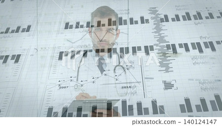 Reviewing physician in white coat and stethoscope holding tablet in clinic, with digital charts Reviewing physician in white coat and stethoscope holding tablet in clinic, with digital charts 140124147