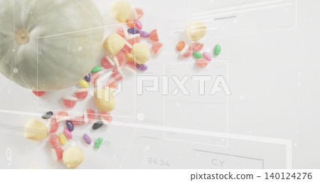 Displaying pale green gourd on white tabletop trailing jellybeans gumdrops and overlays, copy space Displaying pale green gourd on white tabletop trailing jellybeans gumdrops and overlays, copy space 140124276