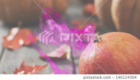 Sitting orange pumpkin catching warm light on wooden table at farm stall, purple mist, copy space Sitting orange pumpkin catching warm light on wooden table at farm stall, purple mist, copy space 140124304