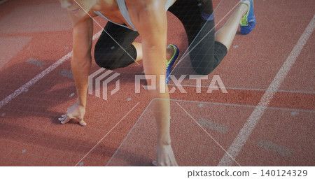 Preparing adult woman pushing from start line on red track, wearing capri leggings and blue shoes Preparing adult woman pushing from start line on red track, wearing capri leggings and blue shoes 140124329
