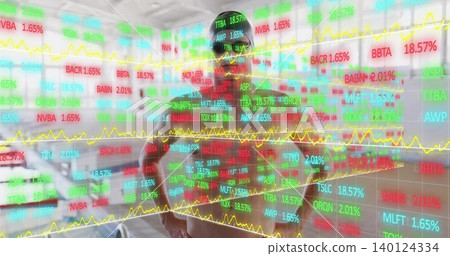 Standing man in dark cap and t-shirt watching projected stock tickers in garage, parked car left Standing man in dark cap and t-shirt watching projected stock tickers in garage, parked car left 140124334