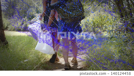 Walking two women carrying backpacks and holding white plastic bag on dirt path, blue speckles Walking two women carrying backpacks and holding white plastic bag on dirt path, blue speckles 140124458