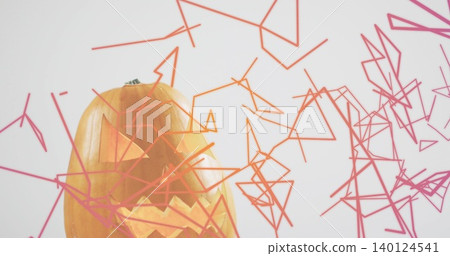 Glowing carved pumpkin emitting warm light at studio with green stem, wireframe shapes, copy space Glowing carved pumpkin emitting warm light at studio with green stem, wireframe shapes, copy space 140124541