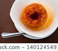 Plate with delicious and healthy dessert - baked apple with spices, in its own juice. 140124549