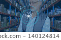 Inspecting man wearing checked shirt, vest, holding tablet in warehouse racks, padlock overlay 140124814