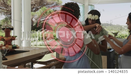Embracing two women wearing green dress and blue dress on veranda, cupcake stand and AR 3549 Embracing two women wearing green dress and blue dress on veranda, cupcake stand and AR 3549 140124835