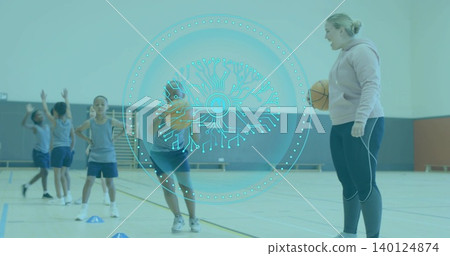 Coaching hoodie coach holding basketball, leading team on school gym, cones, AI overlay, copy space Coaching hoodie coach holding basketball, leading team on school gym, cones, AI overlay, copy space 140124874