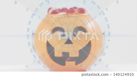Displaying orange pumpkin bucket sitting on pale table, showing red candy and blue radar overlay Displaying orange pumpkin bucket sitting on pale table, showing red candy and blue radar overlay 140124910