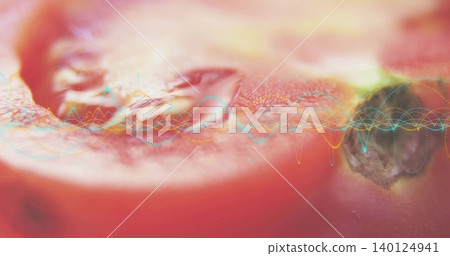 Showing sliced red fruit exposing pulp, dark seed right, dew drops in studio, waveform overlay 140124941