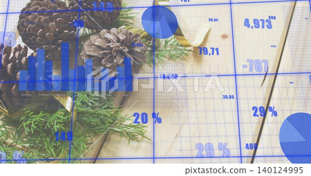 Displaying pinecone cluster with conifer sprigs sitting on wood desk with blue charts, copy space Displaying pinecone cluster with conifer sprigs sitting on wood desk with blue charts, copy space 140124995