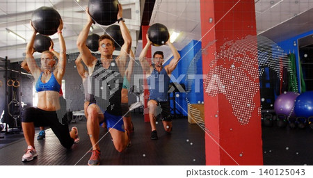 Lunging group of five in activewear holding black medicine balls overhead in gym, map overlay Lunging group of five in activewear holding black medicine balls overhead in gym, map overlay 140125043