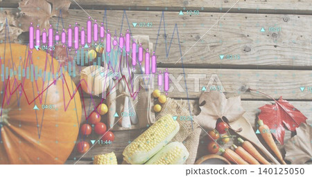 Showing autumn harvest still-life with pumpkin halved corn carrots garlic on wooden planks, charts Showing autumn harvest still-life with pumpkin halved corn carrots garlic on wooden planks, charts 140125050