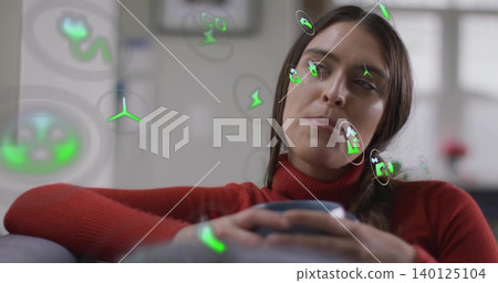 Leaning adult female wearing red turtleneck holding ceramic mug on sofa, with green AR overlays Leaning adult female wearing red turtleneck holding ceramic mug on sofa, with green AR overlays 140125104