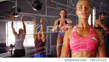 Standing woman in bright pink sportswear at gym with medicine balls and blue dumbbells, copy space Standing woman in bright pink sportswear at gym with medicine balls and blue dumbbells, copy space 140125124