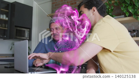 Working senior blue shirt and adult yellow tee using laptop at kitchen island with magenta overlay 140125138