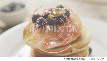 Displaying stack of pancakes sitting on white plate at table, with syrup blueberries pink overlay Displaying stack of pancakes sitting on white plate at table, with syrup blueberries pink overlay 140125194