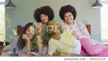Gathering four women wearing loungewear, touching pregnant belly on bed at home, glittering Gathering four women wearing loungewear, touching pregnant belly on bed at home, glittering 140125234