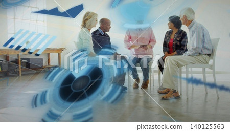 Sitting in loose circle, five adults discussing support in bright room with tablet and blue HUD Sitting in loose circle, five adults discussing support in bright room with tablet and blue HUD 140125563