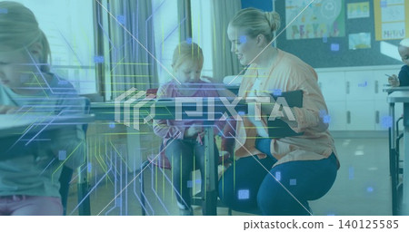 Kneeling teacher leaning toward student in pink hoodie in class holding clipboard with tech overlay Kneeling teacher leaning toward student in pink hoodie in class holding clipboard with tech overlay 140125585