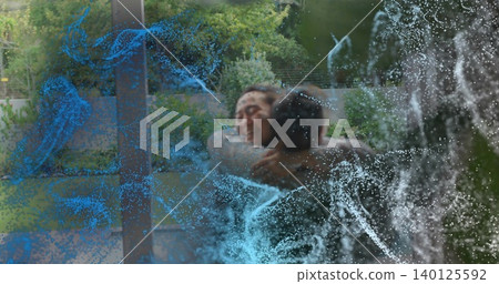 Hugging Korean couple sharing warm embrace in backyard through sliding glass door, blue overlays Hugging Korean couple sharing warm embrace in backyard through sliding glass door, blue overlays 140125592