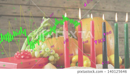 Showing festive centerpiece glowing with lit tapers and fruit on wooden tabletop chart overlay Showing festive centerpiece glowing with lit tapers and fruit on wooden tabletop chart overlay 140125646