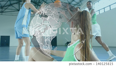 Reaching seated woman athlete extending arm on gym court, wearing green jersey, orange ball, globe Reaching seated woman athlete extending arm on gym court, wearing green jersey, orange ball, globe 140125815