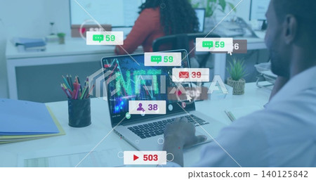 Working man in business shirt viewing laptop NFT graphics, alerts at office pencil holder and plant Working man in business shirt viewing laptop NFT graphics, alerts at office pencil holder and plant 140125842