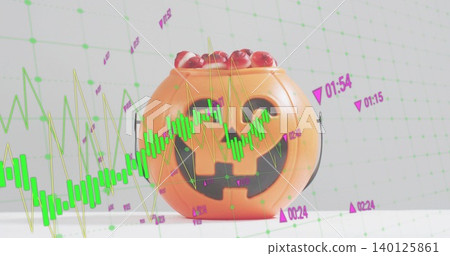 Displaying orange jackolantern bucket holding red candy on white table in studio, with green bars Displaying orange jackolantern bucket holding red candy on white table in studio, with green bars 140125861
