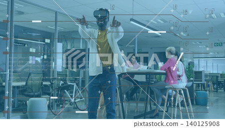 Pointing man wearing VR headset, light cardigan and yellow shirt, interacting with HUD in office Pointing man wearing VR headset, light cardigan and yellow shirt, interacting with HUD in office 140125908