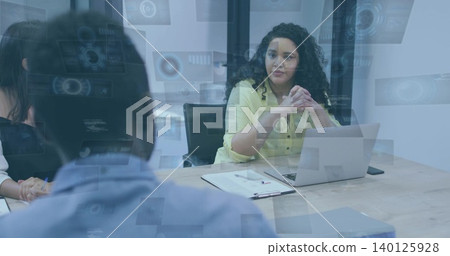 Leading businesswoman in pale yellow blouse guiding meeting at modern office, with laptop Leading businesswoman in pale yellow blouse guiding meeting at modern office, with laptop 140125928