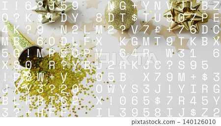 Spilling gold popper confetti and glitter on white table, showing bows, ribbon, stars, text overlay 140126010
