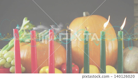 Showing row of seven tapers burning on wooden table at home, with smoke, waveform, pumpkins Showing row of seven tapers burning on wooden table at home, with smoke, waveform, pumpkins 140126020