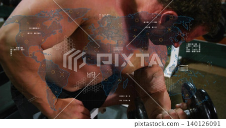 Lifting muscular shirtless man curling heavy dumbbell over bench at gym, with world map overlay 140126091