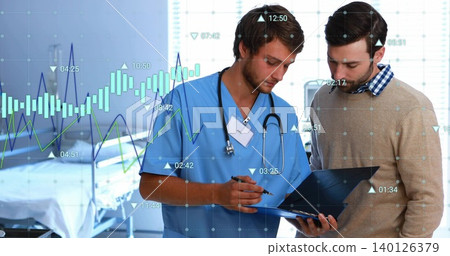 Doctor in blue scrubs checking folder with data overlay at bedside advising beige-sweater patient Doctor in blue scrubs checking folder with data overlay at bedside advising beige-sweater patient 140126379