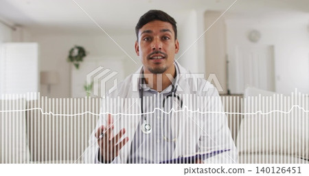 Talking doctor wearing white coat stethoscope sitting on home sofa holding purple file, ECG overlay Talking doctor wearing white coat stethoscope sitting on home sofa holding purple file, ECG overlay 140126451