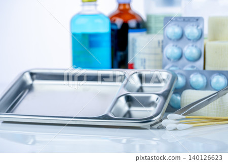 Medical equipment for treating infections. Wound care dressing set. Medical supplies for nurses. Conform bandage, forceps, cotton stick, alcohol. Sterile dressing materials. Healthcare equipment. 140126623