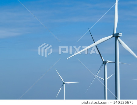 Wind energy and sustainable power generation with wind turbines, Eco-friendly solutions for renewable resources. Wind power farm and sustainable development of renewable energy, green technology. 140126673
