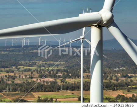 Wind energy and sustainable power generation with wind turbines, Eco-friendly solutions for renewable resources. Wind power farm and sustainable development of renewable energy, green technology. Wind energy and sustainable power generation with wind turbines, Eco-friendly solutions for renewable resources. Wind power farm and sustainable development of renewable energy, green technology. 140126686