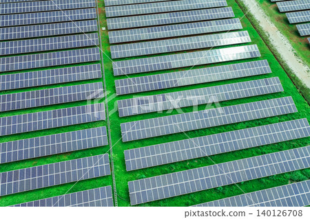 Solar farm and sun light. Solar power for green energy. Sustainable renewable energy. Photovoltaic power station or solar park. Solar panel installation and maintenance concept. Energy sustainability. Solar farm and sun light. Solar power for green energy. Sustainable renewable energy. Photovoltaic power station or solar park. Solar panel installation and maintenance concept. Energy sustainability. 140126708