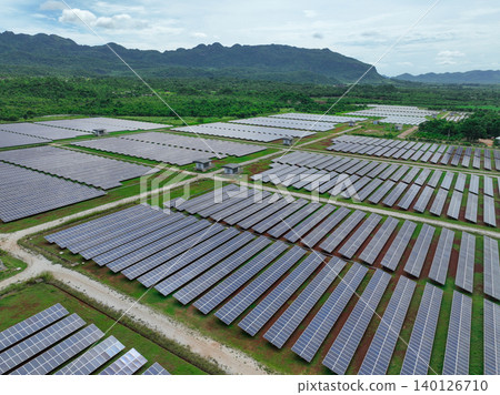 Aerial view of solar farm. Sustainable renewable energy and modern photovoltaic technology for eco-friendly electricity production. Solar power station. Green energy solutions. Solar panel technology. Aerial view of solar farm. Sustainable renewable energy and modern photovoltaic technology for eco-friendly electricity production. Solar power station. Green energy solutions. Solar panel technology. 140126710