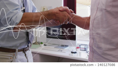 Shaking men exchanging handshake in small office, light-blue and pale-pink shirts, waveform overlay Shaking men exchanging handshake in small office, light-blue and pale-pink shirts, waveform overlay 140127086