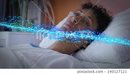 Lying mature woman wearing sleepwear, gazing upward on bed, white pillow, plant, blue light band Lying mature woman wearing sleepwear, gazing upward on bed, white pillow, plant, blue light band 140127121