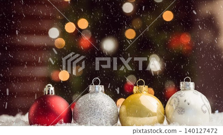 Four 3D render Christmas baubles are glowing on snowy surface, showcasing holiday marketing theme Four 3D render Christmas baubles are glowing on snowy surface, showcasing holiday marketing theme 140127472