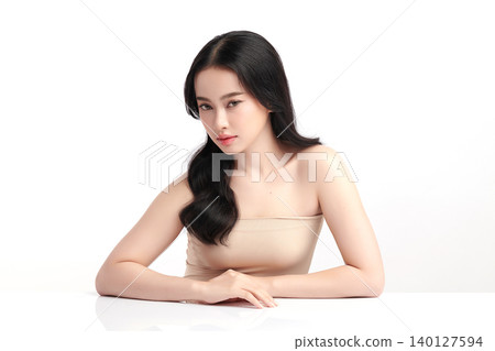 A beautiful young Asian woman with clean, fresh skin against a white background. Skincare, facial treatment, cosmetology, beauty, and spa. An elegant portrait of an Asian woman. A beautiful young Asian woman with clean, fresh skin against a white background. Skincare, facial treatment, cosmetology, beauty, and spa. An elegant portrait of an Asian woman. 140127594